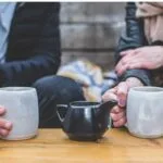couple holding coffee cups light porn use