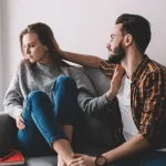 Couple sitting together, wife is sad, how to help your wife heal